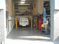 Mechanic servicing car