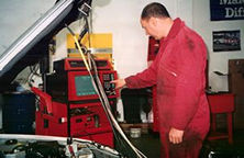 Mechanic servicing car